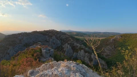 Sunlight bathes rocky peaks, casting warm hues. Soko Grad, Serbia 動画素材 345896899