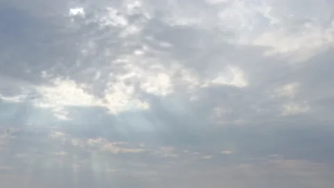 Sunlight beaming through moody clouds after a rainfall Stock Footage 133788308