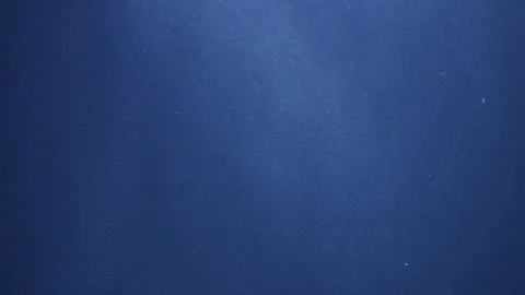 Sunlight beams penetrate the blue depth, lighting up bubbles and particles... Stock Footage 293463259