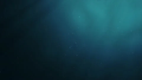 Sunlight beams shining from above coming through deep clear blue water causin Video stock 134450719