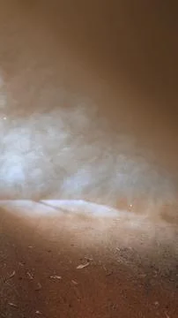 Sunlight beams shining through dust particles and smoke in a dark dusty roo.. Stock Photos