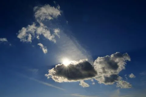 Sunlight behind the cloud on the dramatic moody sky Stock Photos