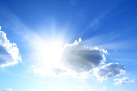 Sunlight behind the clouds in the blue sky Stock Photos