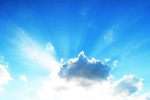 Sunlight behind the clouds in the blue sky Foto stock