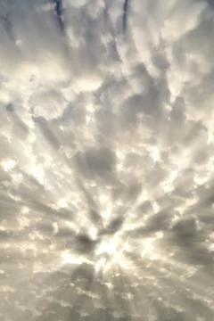 Sunlight behind dark clouds Foto stock