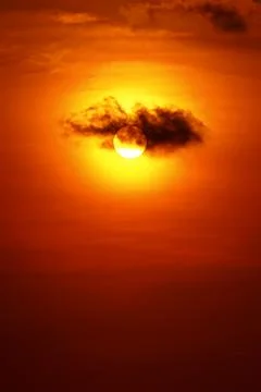 Sunlight behine clouds Stock Photos