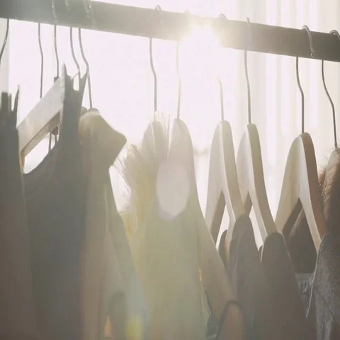 Sunlight between hangers for clothes. Solar Design Studio Stock-Footage 69547434