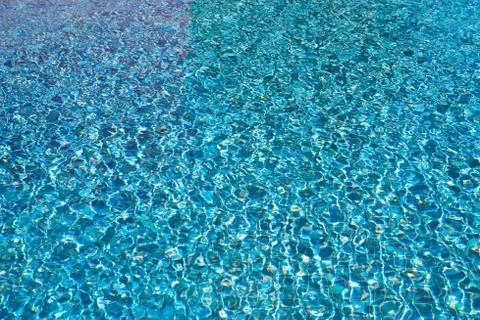 Sunlight on blue water Stock Photos