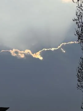 Sunlight Breaking Through Cloud Edge Stock Photos