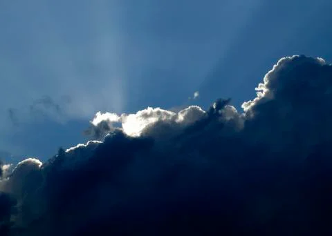 SUNLIGHT BREAKING THROUGH CLOUD Stock Photos