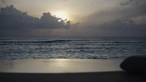 Sunlight Breaking Through Clouds Over a Calm Tropical Ocean Stock Footage 340773235