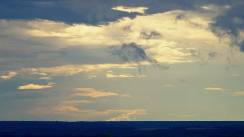 Sunlight breaking through clouds over the African bush Video stock 345521306