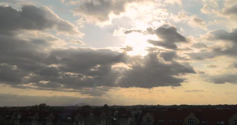 Sunlight breaking through clouds before sunset Stock Footage 252665544