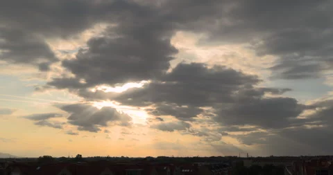 Sunlight breaking through clouds before sunset Stock Footage 252674747