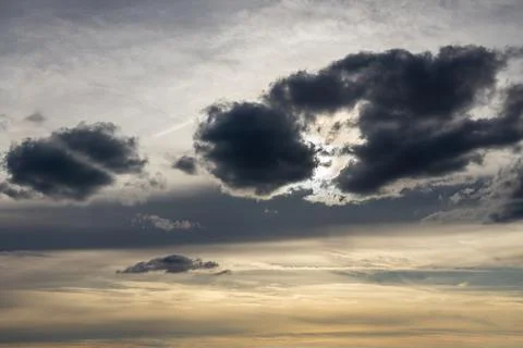 Sunlight breaking through dark clouds. Stock Photos
