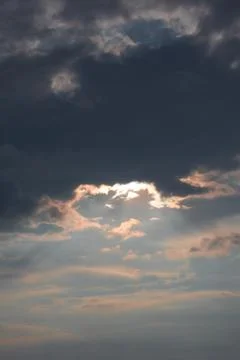Sunlight Breaking Through Dark Clouds Stock Photos