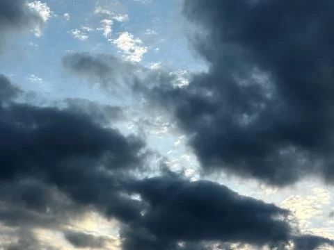 Sunlight Breaking Through Dark Storm Clouds Stock Photos