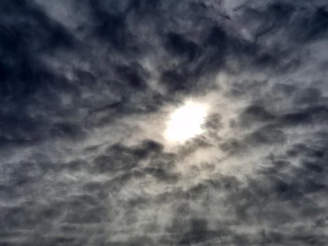 Sunlight Breaking Through Dramatic Cloudy Sky Stockfoto's