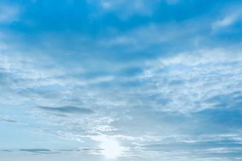 Sunlight breaking through scattered clouds near the horizon 库存照片