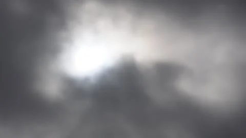 The sunlight breaking through thick, dark clouds Stock Footage 316246046