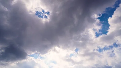Sunlight Breaking Through Thick Storm Clouds In A Bright Blue Summer Sky Stock Footage 342230275