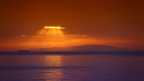 Sunlight breaks through clouds during sunset on Hormoz Island in Iran, Full HD Stock Footage