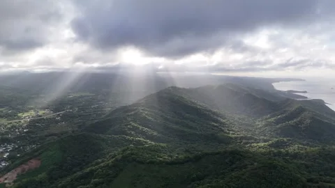 Sunlight breaks through clouds over mountains in Nicaragua Video stock 322129175