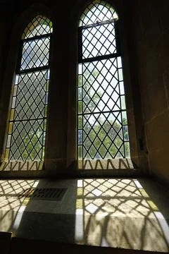 Sunlight Casting Diamond Patterned Shadows Through Church Window Stock Photos