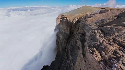 Sunlight casting dramatic shadows on rugged mountain slopes, sharp rocky peaks Stock Footage 304522862