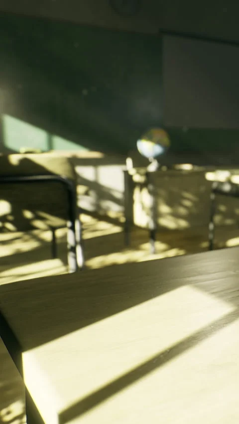 Sunlight casts shadows in an empty classroom during afternoon hours Stock Footage 335236748
