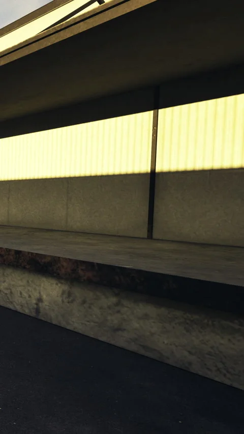 Sunlight casts warm hues on the empty train platform in the quiet morning Stock Footage 331697504