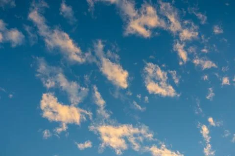 Sunlight change white clouds to orange at sunset Stock Photos