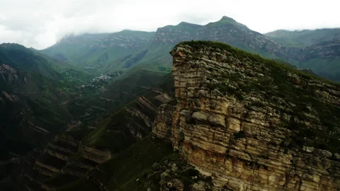 Sunlight on Cliff's Edge Over Valley. Stock Footage 261010146