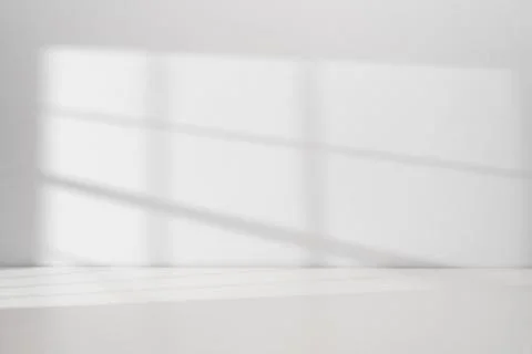 Sunlight coming through the window on the white wall Stock Photos