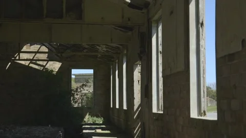 Sunlight coming through windows of an abandoned buidling Stock Footage 159473776