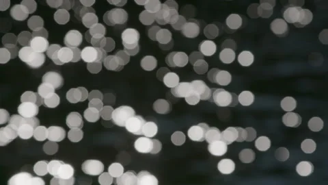 Sunlight dancing on the surface of water, creating a captivating reflection Video stock 300647467