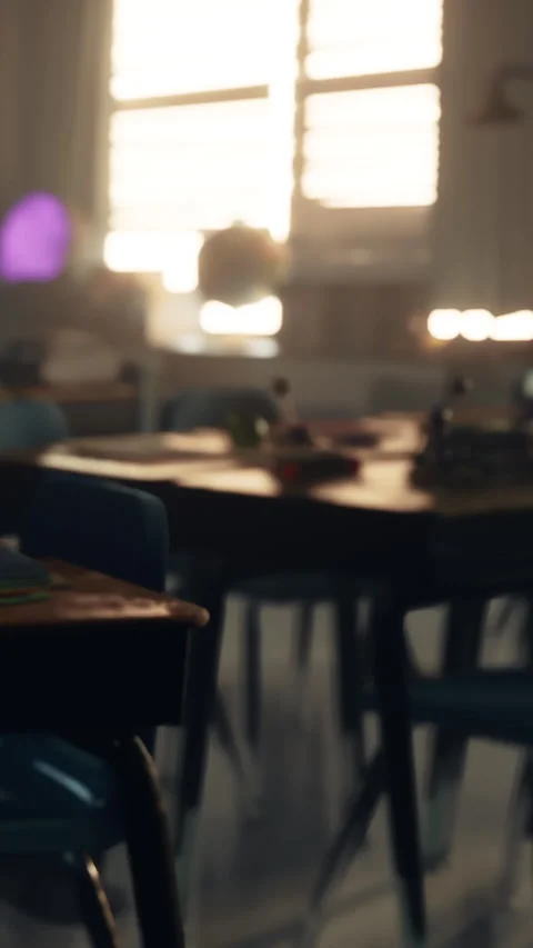Sunlight entering a classroom during the day with empty desks and chairs Stock Footage 339393062