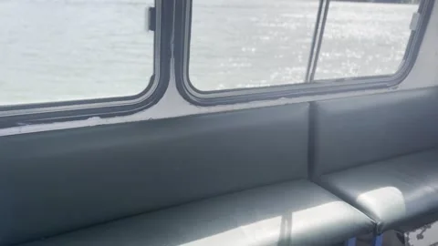 Sunlight Entering Old Ferry Interior Through Large Windows Over River Vídeos de archivo 342030850