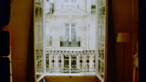 Sunlight entering room through open window in paris Stock Footage 312993857