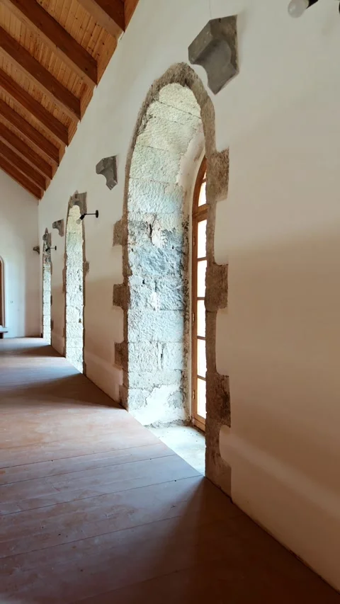 Sunlight entering through arched windows in restored building Vidéo 315359419