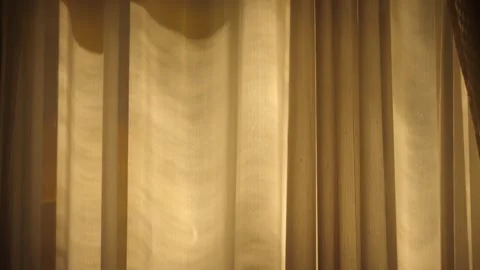 Sunlight in the evening on curtain behind a window Stock Footage 244301233