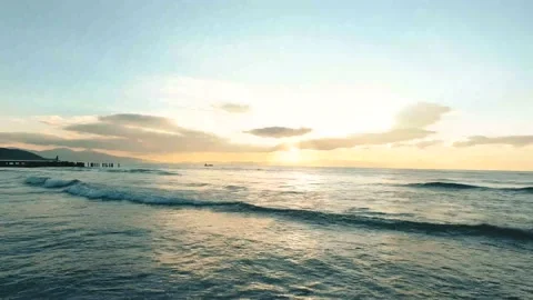 Sunlight falling into the sea at sunset Drone Shot 4K Stock Footage 146692635