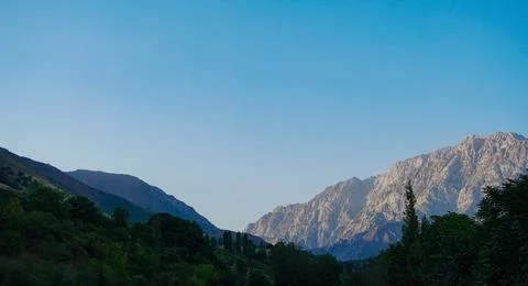 Sunlight falls on the mountain Stock Photos