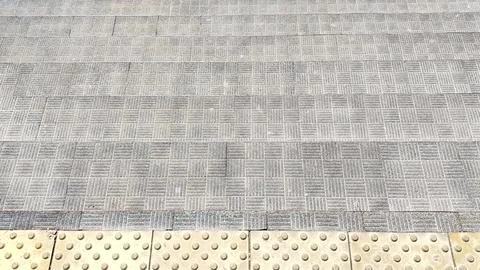 Sunlight falls on the steps of the staircase, creating the illusion of a flat Stock Photos
