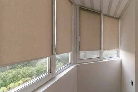 Sunlight filtering through closed window shades in a balcony. Stock Photos