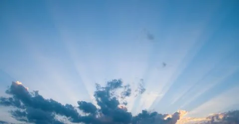 Sunlight filtering through the clouds Stock Photos