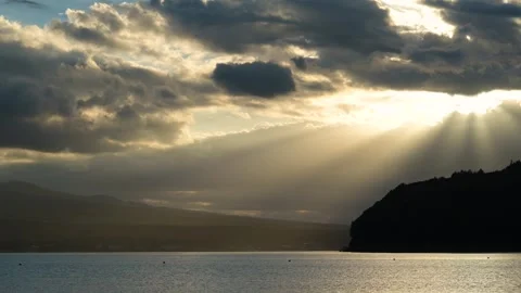 Sunlight filtering through dramatic sunset clouds, lake Yamanaka, Yamanashi Video stock 249639615
