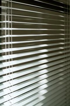 Sunlight Filtering through Modern Office Window Blinds Stock Photos