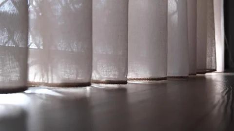 Sunlight filtering through sheer white curtains, low angle, ambience atmosphere Vídeos de archivo 244139833