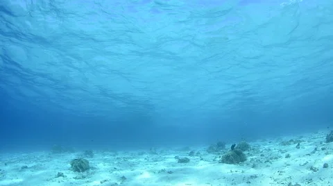Sunlight Filters Through Blue Water 3 Stock Footage 64372173